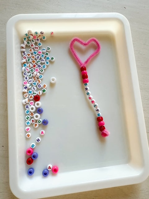 stay at home activity mom Valentine's Day Bubble Wands activity with pipe cleaner and beads